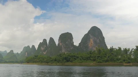 Sugar loaves scrolls from a river on a boat, in China Stock Footage 232172603