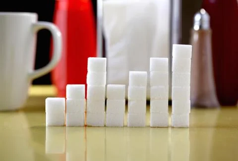 Sugar lumps stacked in shape of graph Stock Photos