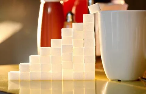 Sugar lumps stacked in shape of graph Stock Photos