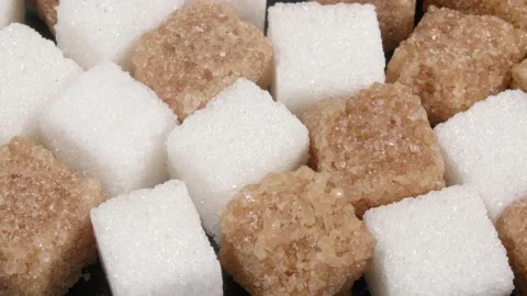 Sugar lumpy close-up. White and brown sugar. Stockbeeldmateriaal 140813299