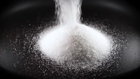 Sugar or salt falling in slow motion from above on black background 스톡 동영상 247336271