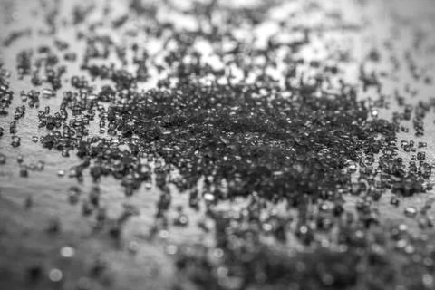 Sugar over black reflective surface Stock Photos