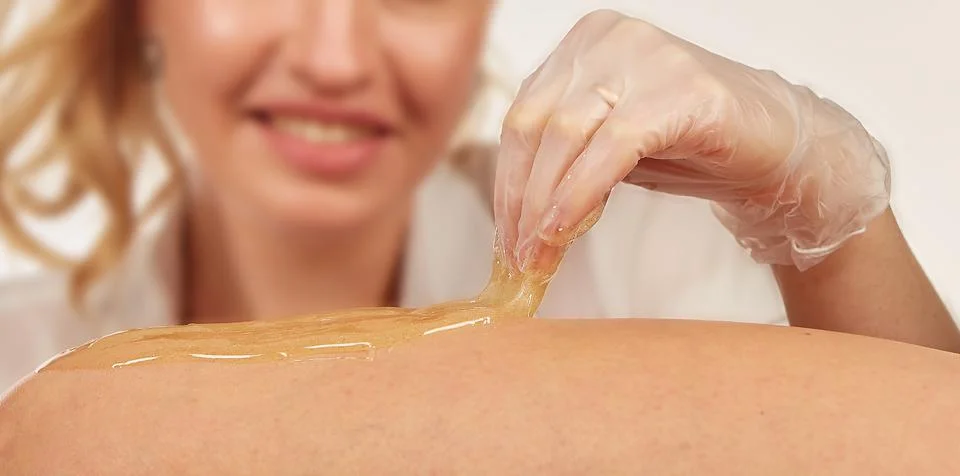 Sugar paste for depilation in the light Stock Photos