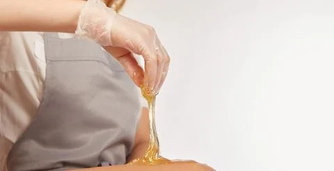 Sugar paste for depilation in the light Stock Photos