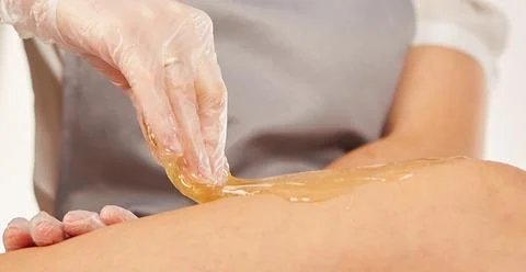 Sugar paste for depilation in the light Stock Photos