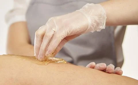 Sugar paste for depilation in the light Stock Photos