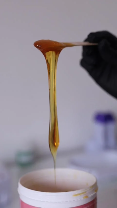 Sugar paste for depilation, liquid and dripping Video stock 276546040