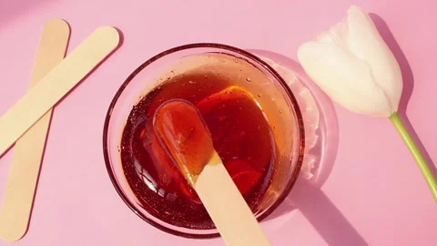 Sugar paste for shugaring on a pink background. Stock Footage 153101687