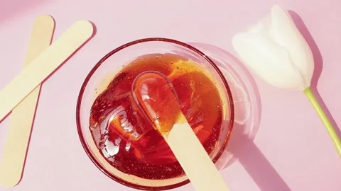 Sugar paste for shugaring on a pink background. Stock Footage 153101692