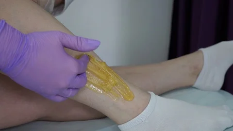 Sugar paste. Sugaring, depilation. Smooth skin legs. Waxing with sugar. Stock Footage 89063707