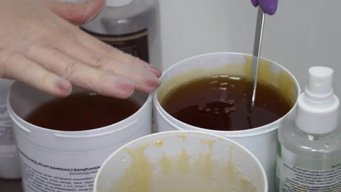 Sugar paste. Sugaring, depilation. Smooth skin legs. Waxing with sugar. Stock Footage 89063775