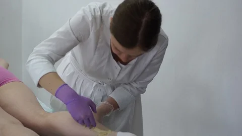 Sugar paste. Sugaring, depilation. Smooth skin legs. Waxing with sugar. Stock Footage 89063814