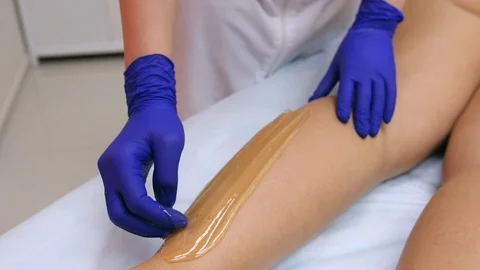 Sugar paste, sugaring, depilation. Smooth skin legs, clear soft skin body Stock Footage 97097935