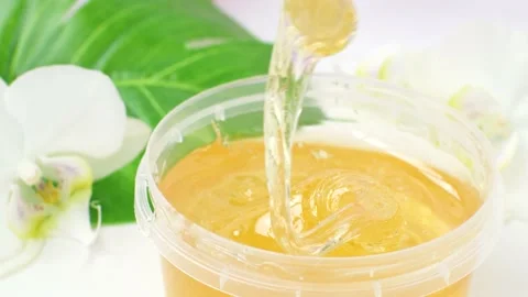 Sugar paste in a transparent jar on a white background. Stock Footage 172372894