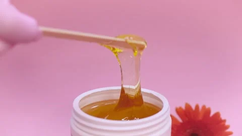 Sugar paste in a white jar on a pink background Stock Footage 137631963