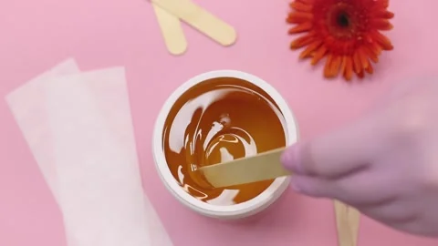 Sugar paste in a white jar on a pink background. Stock Footage 137631972
