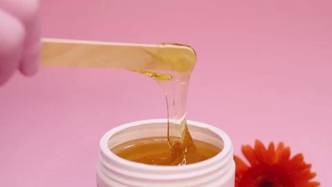 Sugar paste in a white jar on a pink background. Stock Footage 137649208