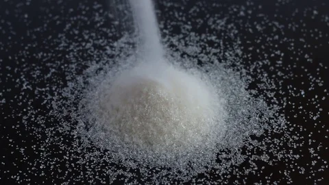 Sugar pour black background Video stock 74248978