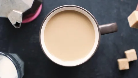 Sugar poured into coffee Stock Footage 86015230