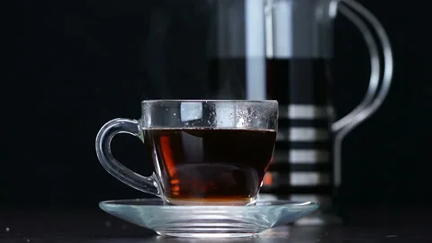 Sugar is poured into a cup of tea Stock Footage 120578974