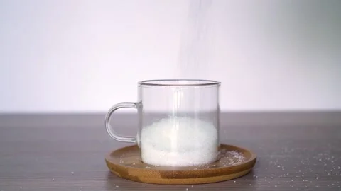 Sugar is poured into a mug Stock Footage 168465801