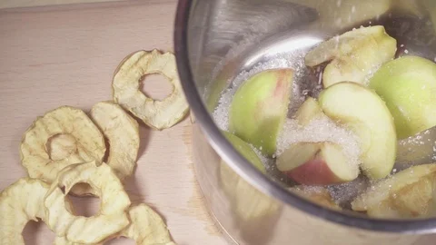 Sugar is poured into a pot of apples slow motion Stock Footage 88401830