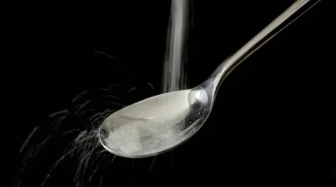 Sugar pouring onto spoon Video stock 10817462