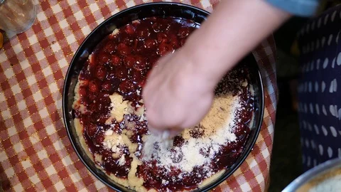 Sugar Powdered Cherry Pie. Close up hands Isolated. Top view.  Stockbeeldmateriaal 124033415