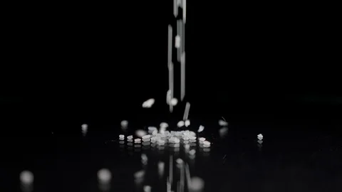 Sugar raining on the table in kithchen Stock Footage 86389349