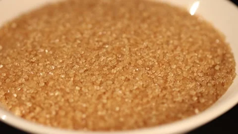Sugar In The Raw Brown Sugar Crystals in White Bowl 01 Video stock 295446953