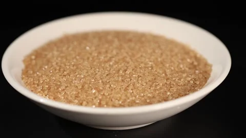 Sugar In The Raw Brown Sugar Crystals in White Bowl 02 Video stock 295446997