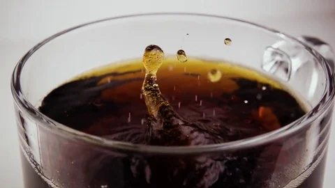 Sugar sand is poured into tea. Slow mo Stock Footage 75676088
