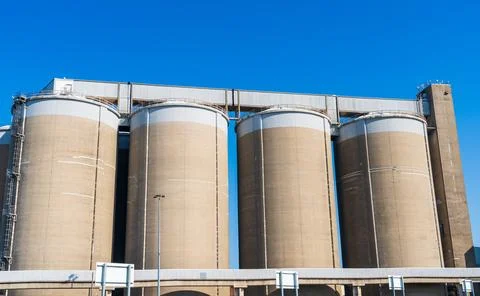 Sugar silos at a sugar processing plant Stock Photos