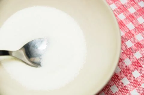 Sugar on a spoon Stock Photos