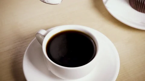 Sugar from a spoon is poured into a cup slow motion Stock-Footage 88822300