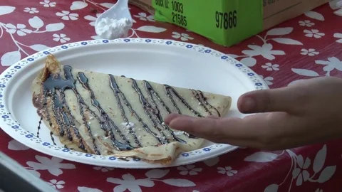 Sugar sprinkled on crepe Stock Footage 70640199