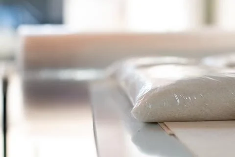 Sugar. Sugar packets. Grain store. Stacking of sugar bags. Agricultural sector. Stock Photos