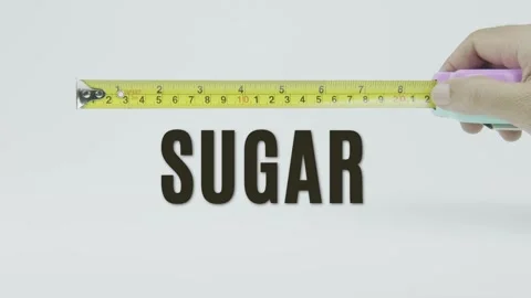 Sugar text or word and tape measure on a white background Stock Footage 302118743