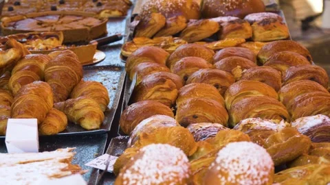 Sugar topped buns in bakery showcase Stock Footage 334656063
