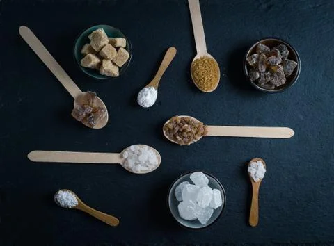 Sugar variation set on dark stone background Stock Photos