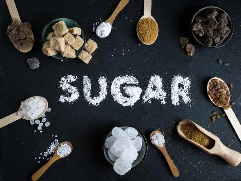 Sugar variation set on dark stone background Stock Photos