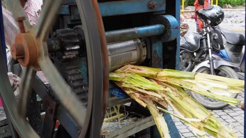 A sugarcan juice making machine india Stock Footage 247373640
