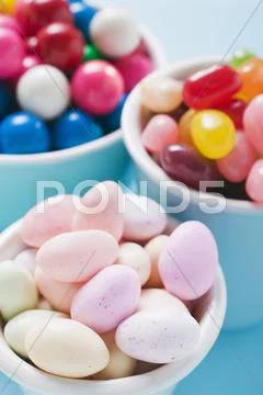 Sugared almonds, jelly beans and bubble gum Stock Photos
