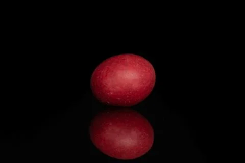 Sugared nut dragee isolated on black glass Stock Photos