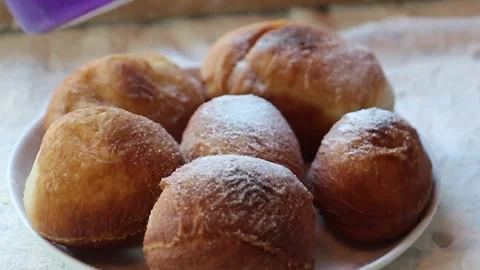 Sugaring Fresh Donuts Close Up Stock Footage 329397031