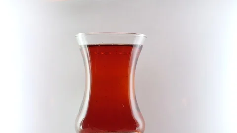Suger cubes drop into a Turkish Tea glass Stock Footage 118887837