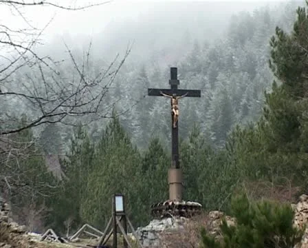 Suggestive crucified under the snow on mountain Stock Footage