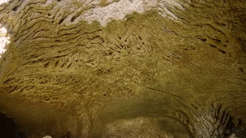 Suggestive sandstone patterns creating an abstract design inside Pizzo Calabrian Stock Footage 311697167