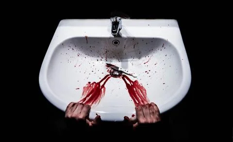 Suicide concept - bleeding hands and knife in a sink Stock Photos
