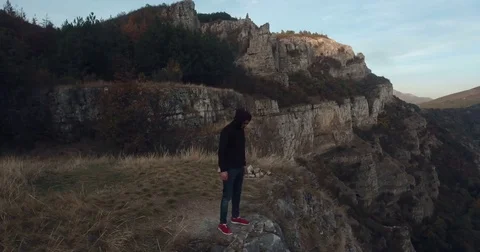 Suicide Jumping Off A Cliff Drone View 4K Stock Footage 81220158